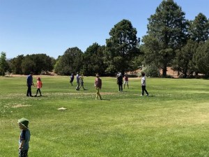 The kickball game in an early inning. The teams where randomly divided based on the ending digits of a raffle ticket.